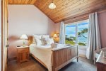 Upstairs Queen Bedroom at Cove Beach Lodge